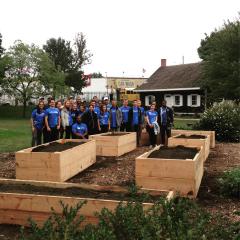 Building new raised garden beds with volunteers