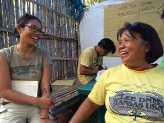 Empowering women post-Super Typhoon Haiyan: Two Filipina women exchange big smiles, Bantayan Island, Visayas, Philippines, 2015. Photo by Cecilia L