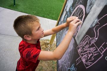 Child at Chalkboard
