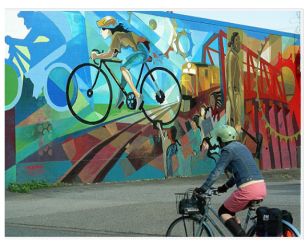 This is an example of what the mural could potentially look like. We like the cycling and trail theme along with the vibrate colors.