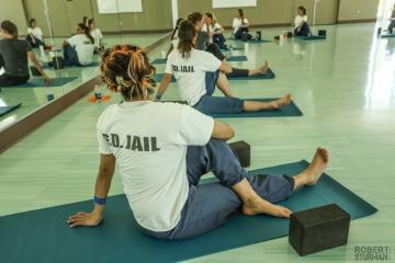 Women in prison in a yoga class