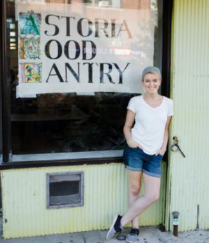 Macaela the pantry's founder standing outside our location on Steinway St.