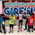 Garfield children pose together in front of "welcome to Garfield" sign